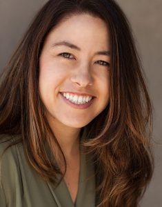 Smiling woman with long brown hair