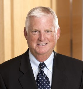 Smiling older man in suit and tie